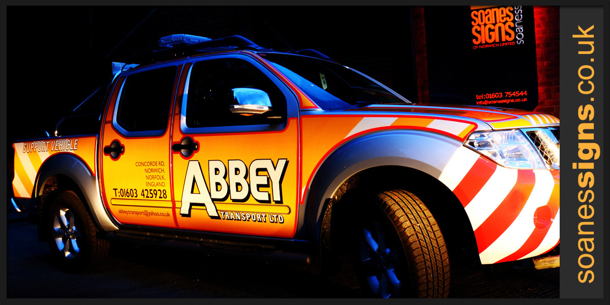 Abbey Transport Nissan Navara 4x4 wide load support vehicle with reflective vinyl graphics applied to sides, rear and bonnet