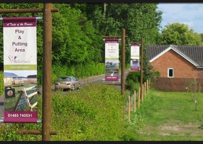 Double sided banners on tensioned arm system fitted to custom made bespoke timber frames for The Waterside