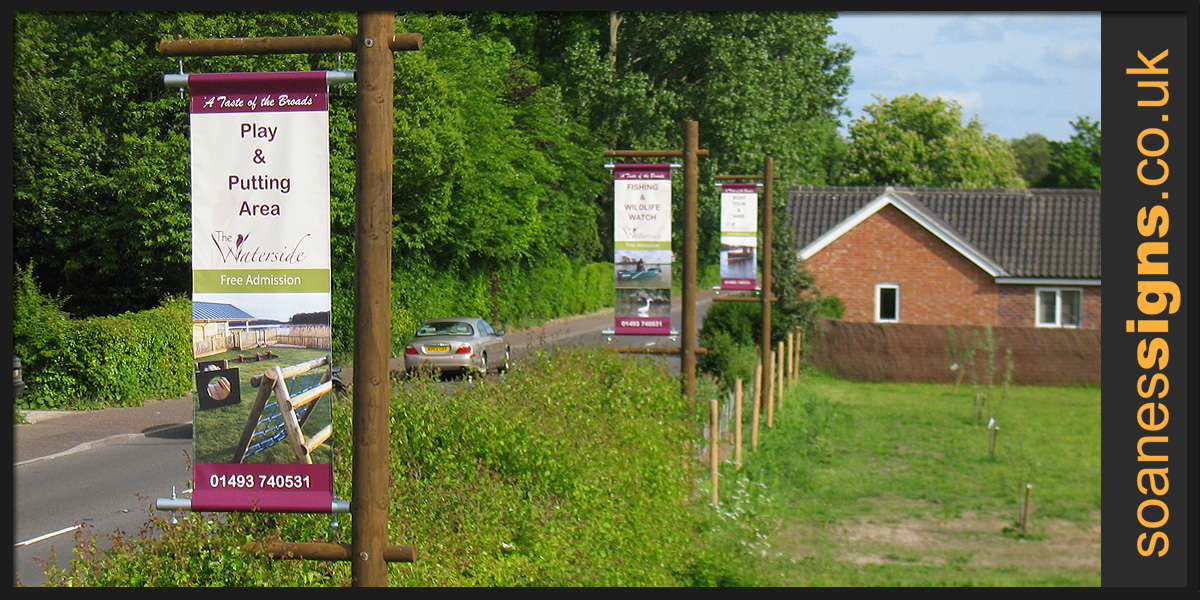 Double sided banners on tensioned arm system fitted to custom made bespoke timber frames for The Waterside