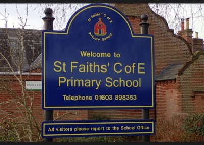 Entrance post mounted aluminium double panel entrance sign with printed and applied graphics for St Faiths’ Church of England Primary School