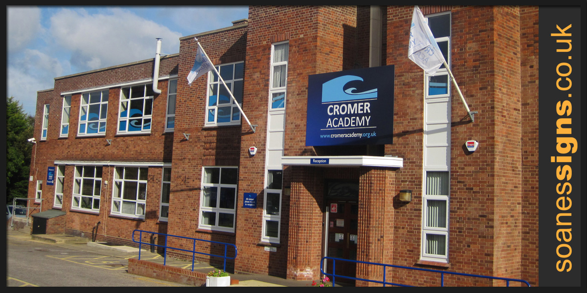 Front entrance printed signage, flags and window graphics installed as part of a full revamp of Cromer Academy