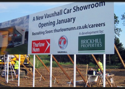 Large panel multi-panel and multi-posted Vauxhall car showroom development sign with printed and applied vinyl graphics