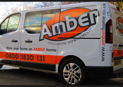 Large scale vinyl cut logo graphics and branding applied to Amber Home Improvements Renault Traffic vehicle
