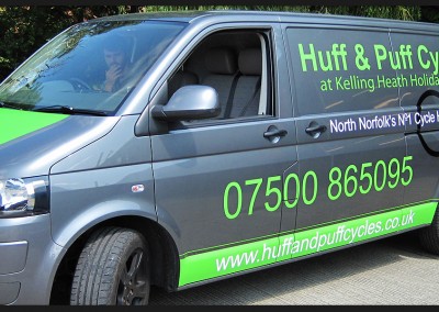Vehicle wrap vinyl applied as green racing stripe to back doors and bonnet of Huff and Puff Cycles VW Transporter along with and vinyl graphic branding
