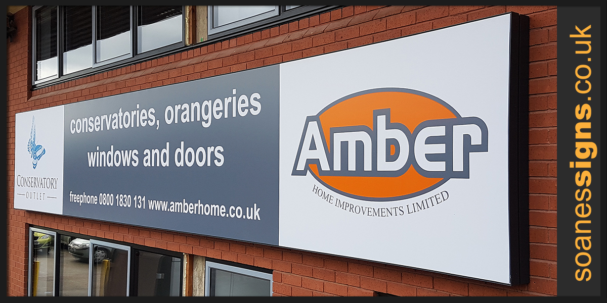 Backlit flex-face sign, stretched printed material over aluminium frame and LED backlight, installed for Amber Home Improvements