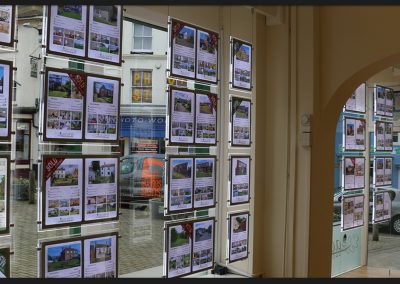 Double sided backlit LED light panels for estate agent window display, with supporting timber beam, at Acorn Properties