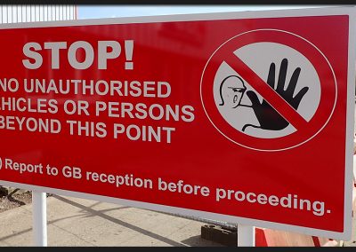 Health and Safety stop sign, aluminium panel with printed vinyl graphics, fitted on rails to aluminium posts and installed for GB Plant