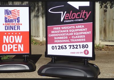 Heavy duty pavement signs with poster clip frames, water filled base and size options