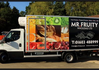 Full vinyl print applied to the box sides of Mr Fruity Iveco Truck with supporting vinyl brand graphics